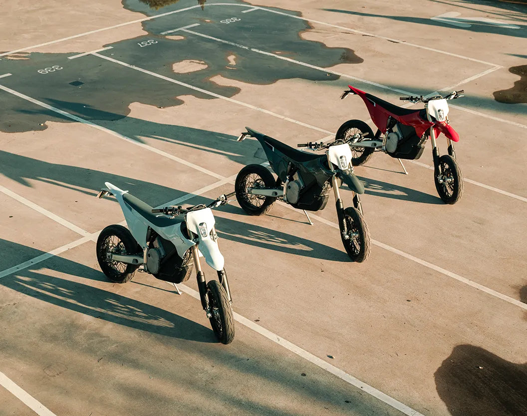 Three Stark VARG SM motorcycles parked together, official Stark Future photograph