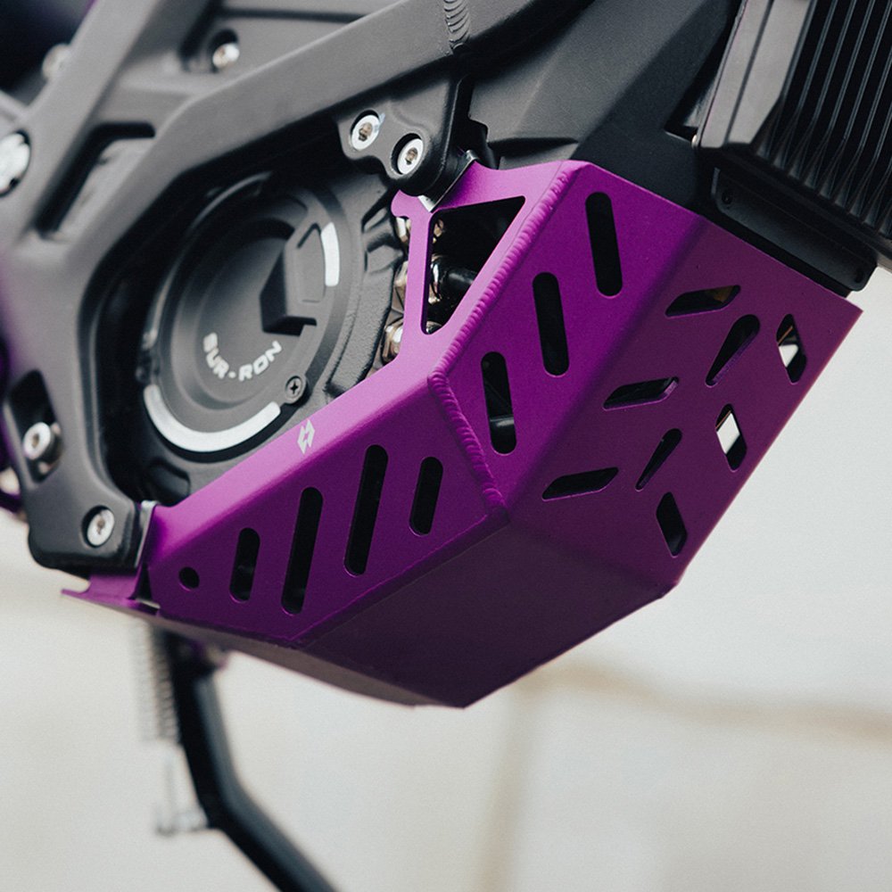 Purple engine guard bashplate fitted to a Sur-Ron Light Bee