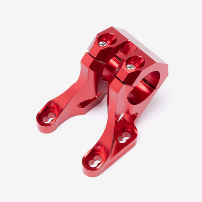 Red 31.8mm handlebar risers, alternate angle showing clamp bolts