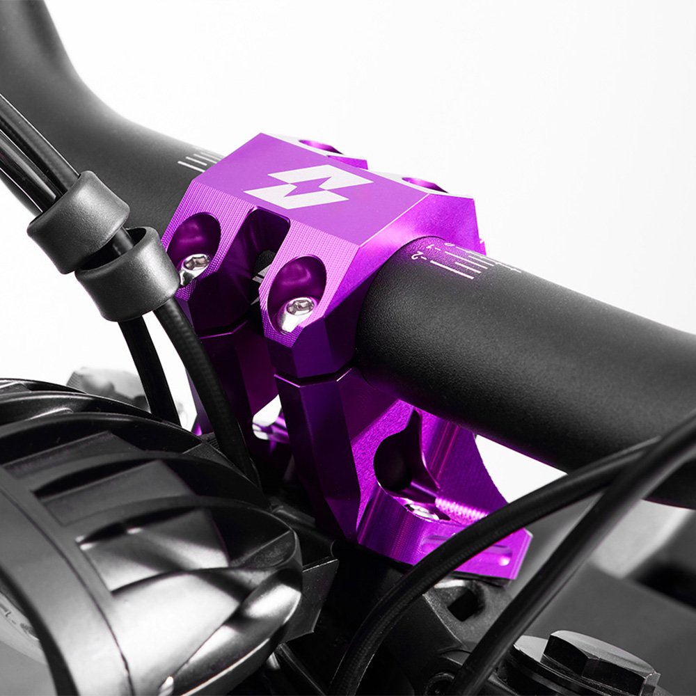 Purple 31.8mm handlebar risers, side profile showing rise height