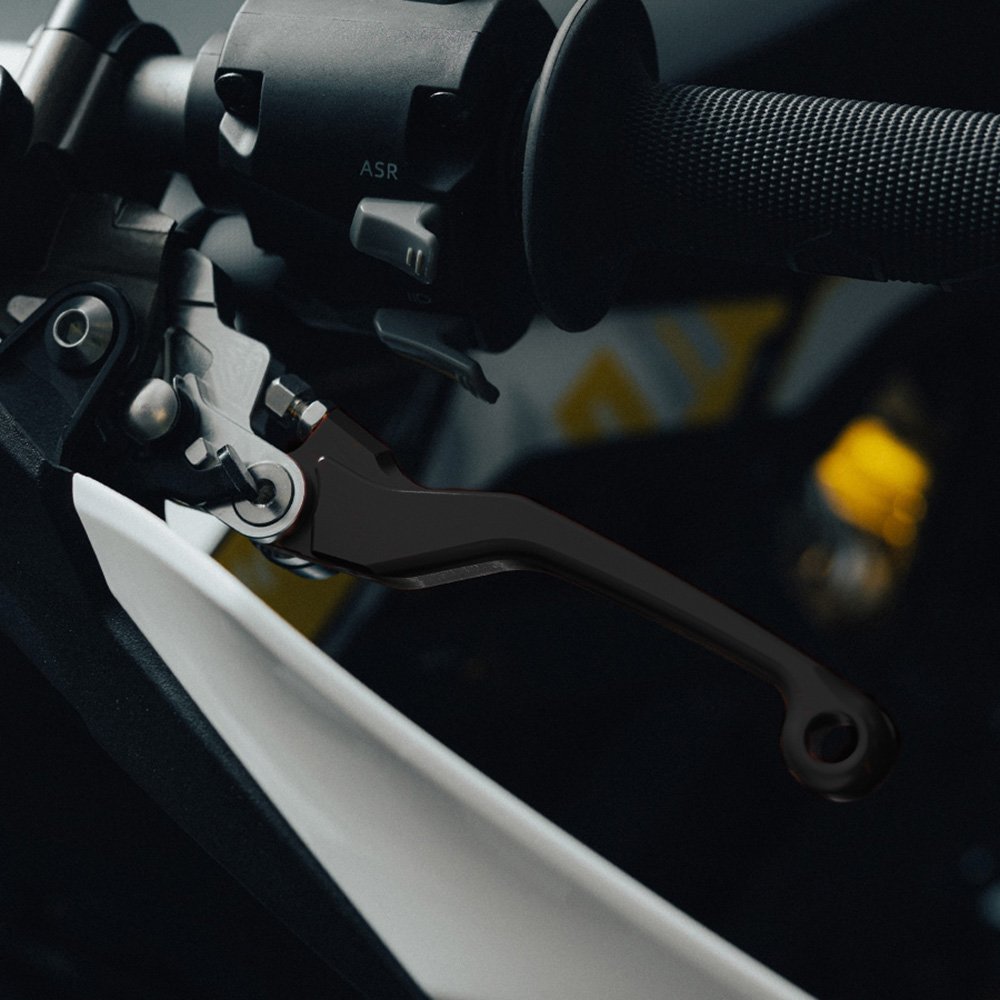 Black adjustable brake levers for Sur-Ron Ultra Bee, fitted to a handlebar