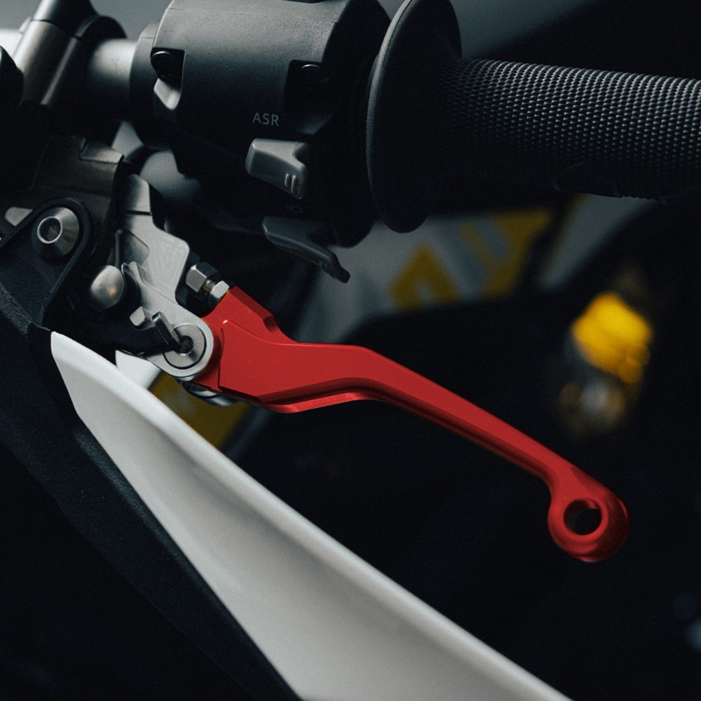 Red adjustable brake levers for Sur-Ron Ultra Bee, fitted to a handlebar