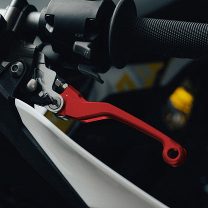 Red adjustable brake levers for Sur-Ron Ultra Bee, fitted to a handlebar
