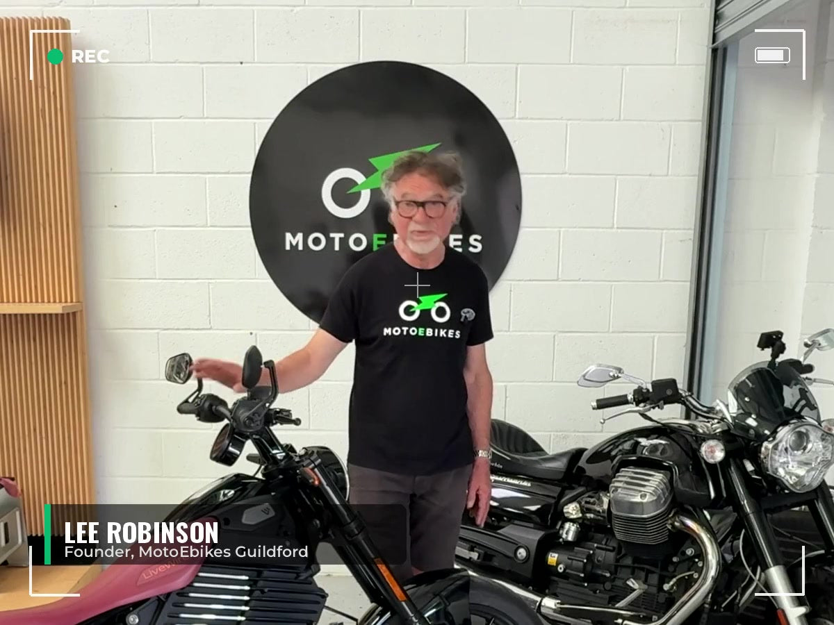Lee Robinson, founder of MotoEbikes, presenting in the Guildford showroom